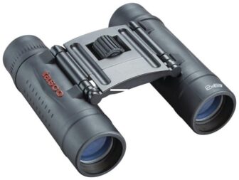 Compact Tasco binoculars with a central hinge and blue-tinted lenses for distant viewing by handrails color.