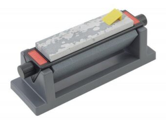 Manual knife sharpener with a rectangular abrasive stone mounted on a gray plastic base and red end caps for easy sharpening control